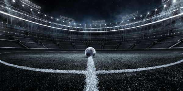 uefa champions league soccer stadium with soccer ball in the center of the field