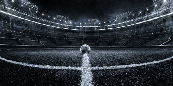 uefa champions league soccer stadium with soccer ball in the center of the field